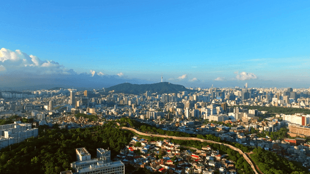Sprawling cityscape with distant mountains