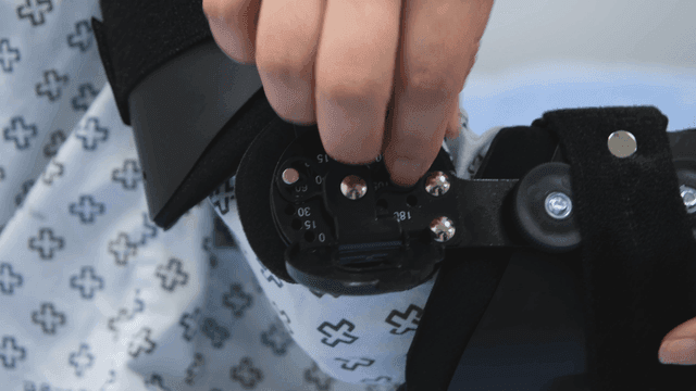 Adjusting a medical brace on an arm