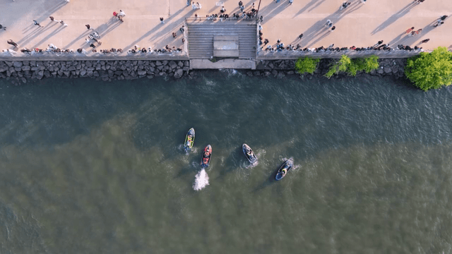 Enjoying jet skiing on the riverside with people
