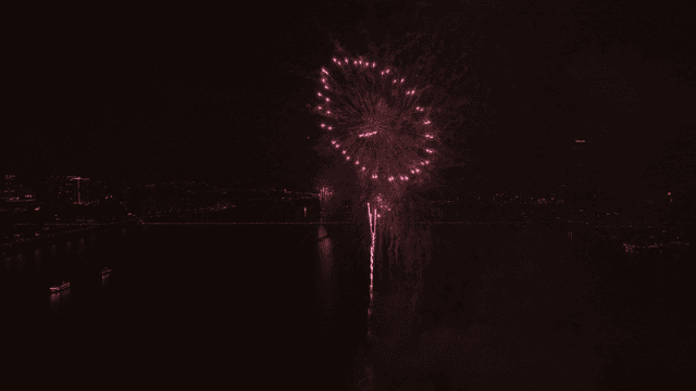 Fireworks display over a city skyline