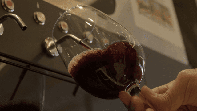 Red wine poured into wine glass