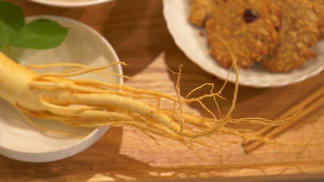 Fresh ginseng and various ginseng desserts on a plate