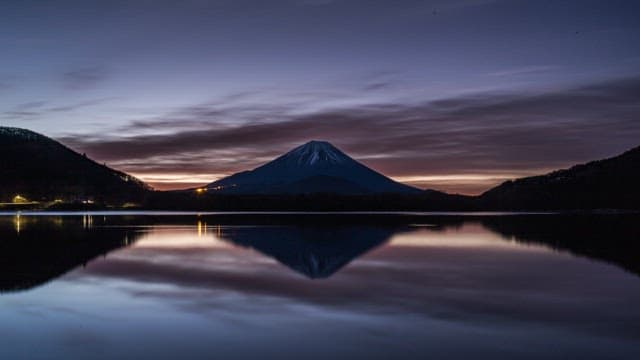 Mount Fuji at dawn with a serene lake