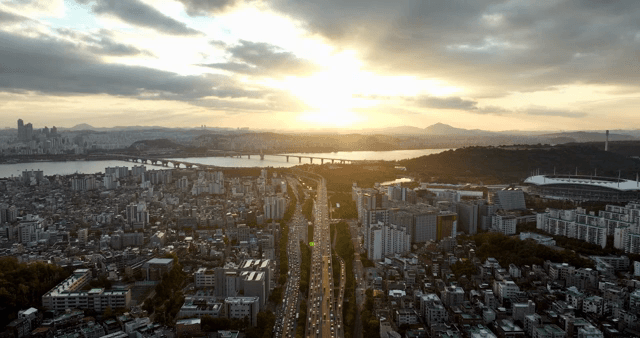City skyline with a river and sunset