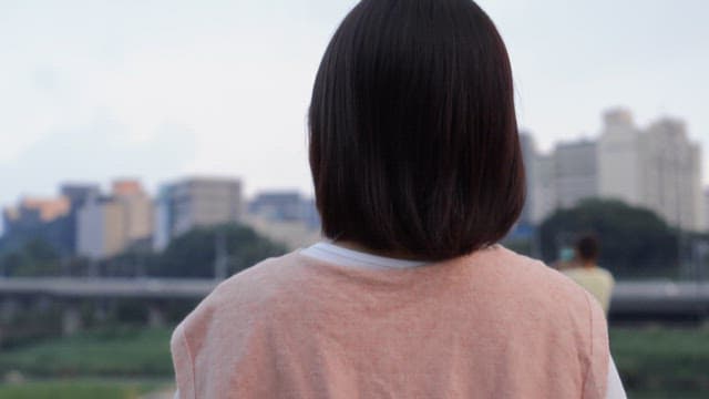 Woman smiling by the riverside