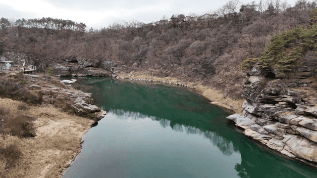 Tranquil river surrounded by rocky cliffs
