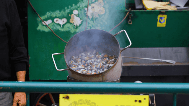 Chestnuts roasting in a pot with steam