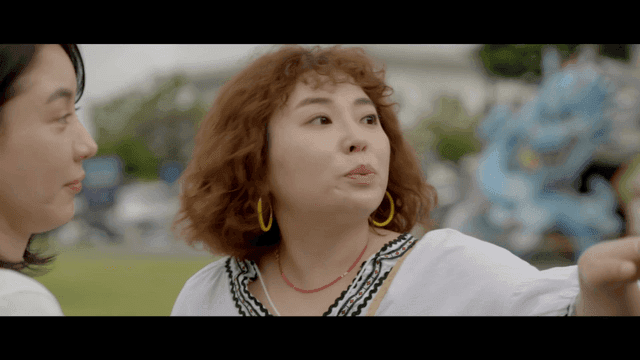 Two women having a conversation outdoors