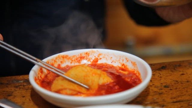 Enjoying spicy fish cake with rice