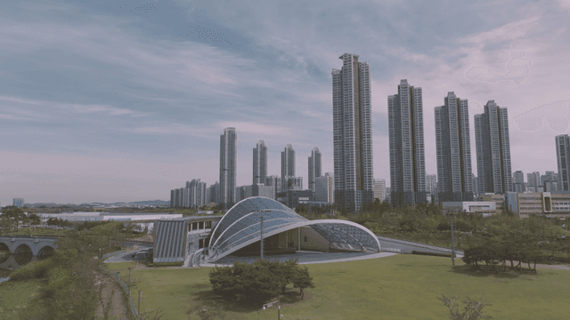 Modern city skyline with green park
