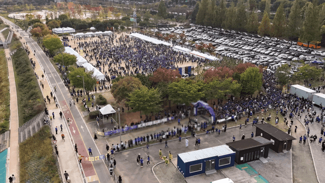 Large crowd gathered at outdoor event venue