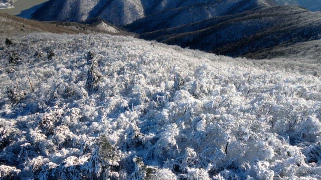 Magnificent view of snow-covered white mountains under a clear sky