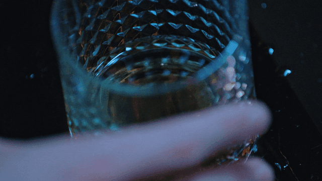 Reaching for a glass of alcohol