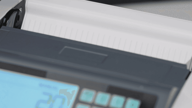 Counting machine processing dollar bills