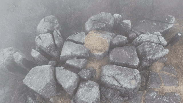Foggy mountain rocks in a misty landscape