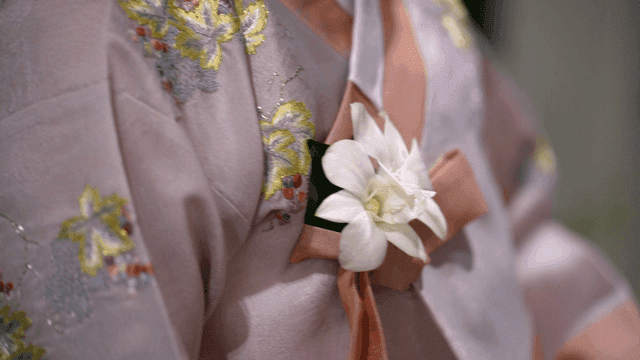 Traditional Korean attire with floral detail