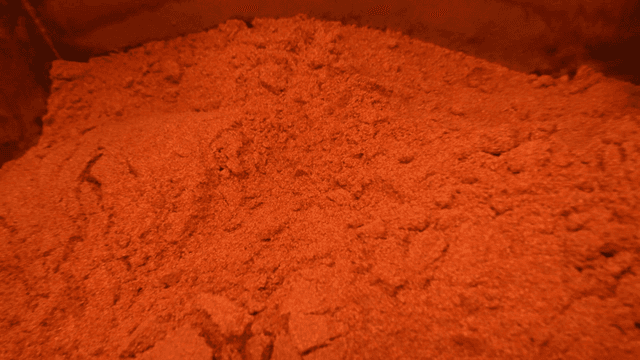 Container filled with red chili powder