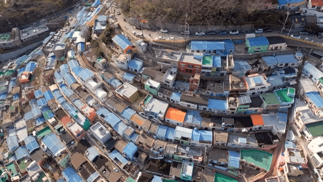 Colorful hillside village with dense houses
