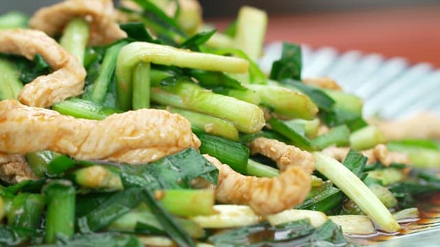 Fresh chive and meat stir-fry on a plate