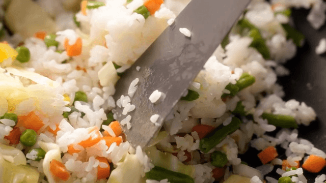Colorful vegetable fried rice in a pan