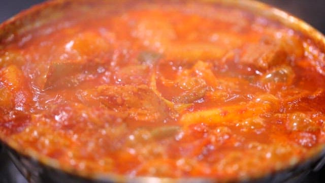 Spicy braised ribs boiling in a pot