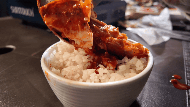 Braised fish poured over rice