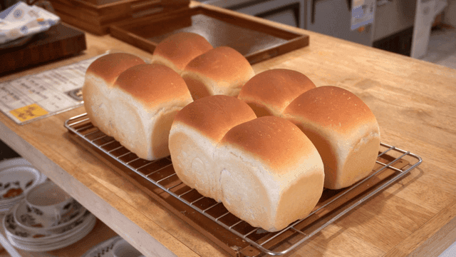 Freshly baked bread on a cooling rack