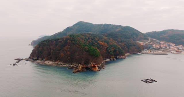 Autumn-Colored Forests and Coastal Villages