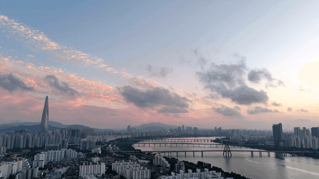 City skyline with view of river at sunset