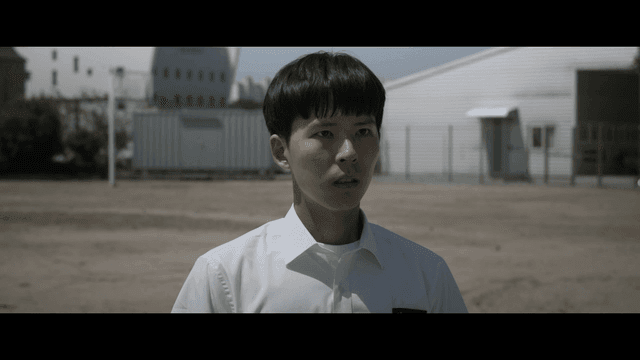 Anxious student standing in schoolyard