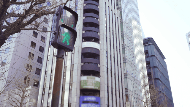 City skyscrapers and traffic light with green light