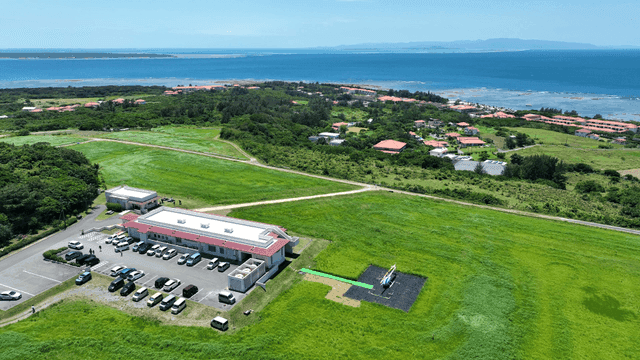 Coastal scenery with helicopters and greenery