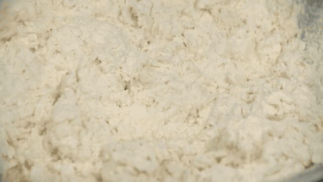 Scene of mixing flour dough with a spatula