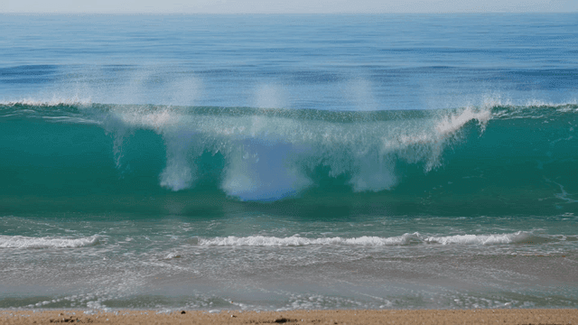 Waves gently crashing on a sandy beach