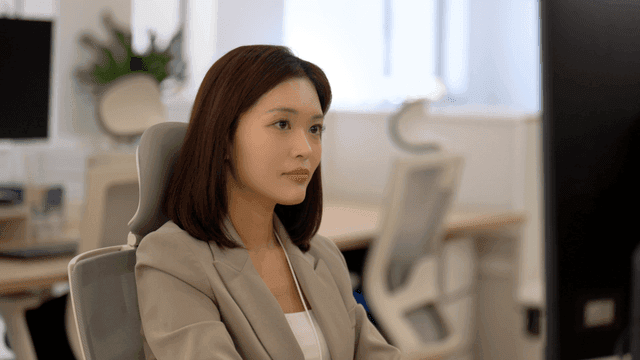 Working woman focused on her work in office
