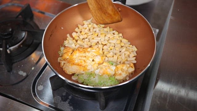 Frying pan with eggs and bamboo shoots