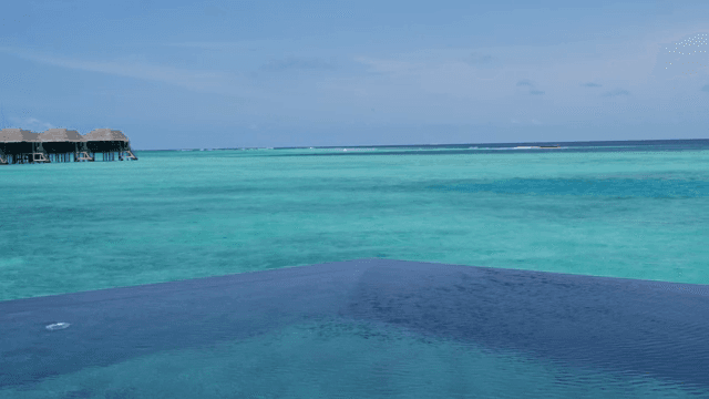 A serene ocean view with overwater bungalows