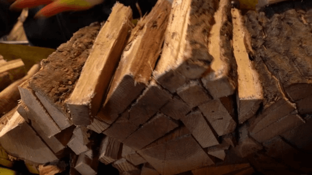 Stack of cut wood pieces on a conveyor