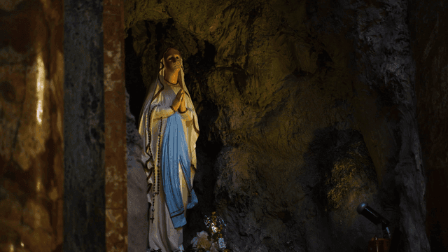 Statue of the Virgin Mary in a grotto