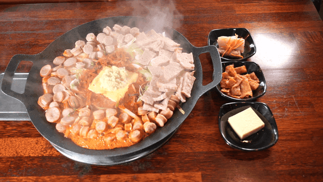Budaejjigae and side dishes on table