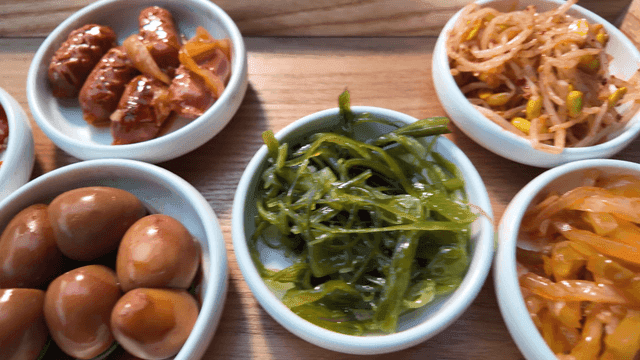Various Korean side dishes on tray