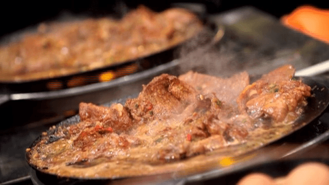 Marinated galbi being cooked in a pan