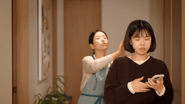 Woman nagging her daughter for looking at her phone