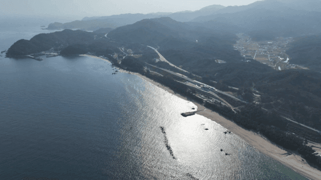 A scenic coastal view with mountains