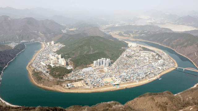 City surrounded by mountains and rivers
