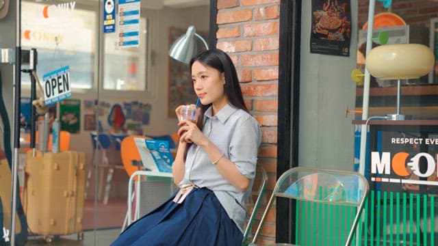 Young woman relaxing and drinking coffee