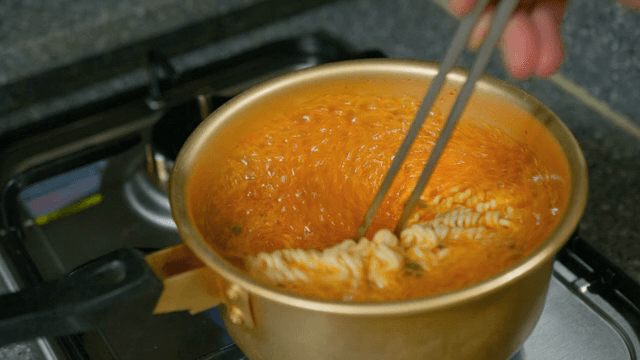 Instant Ramyeon boiling in a pot
