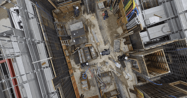 Construction site with scaffolding and worker