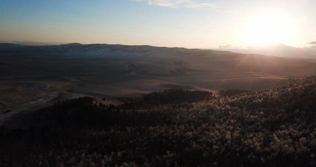 Sunrise over a vast mountain landscape