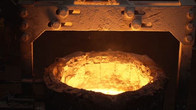 Molten metal being processed in a foundry